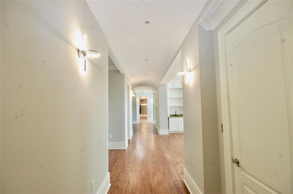 6509 Lily Trail Fairburn, GA 30213 - Photo 109 of 117 a view of a hallway with wooden floor