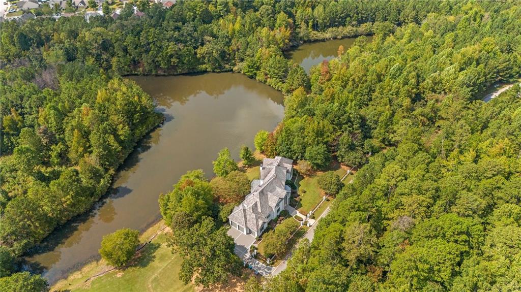 6509 Lily Trail Fairburn, GA 30213 - Photo 116 of 117 a view of a lake with a yard and mountain view