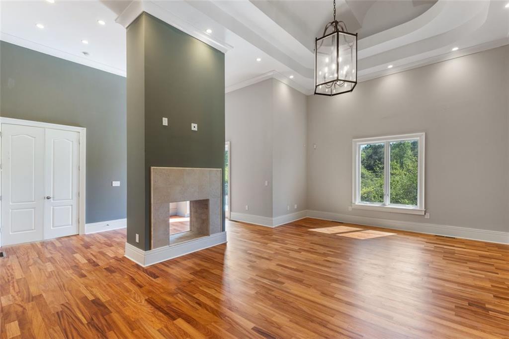 6509 Lily Trail Fairburn, GA 30213 - Photo 21 of 117 a view of empty room with wooden floor and window