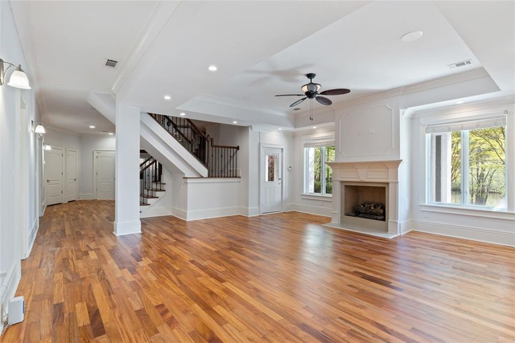 6509 Lily Trail Fairburn, GA 30213 - Photo 35 of 117 a view of empty room with wooden floor and fireplace