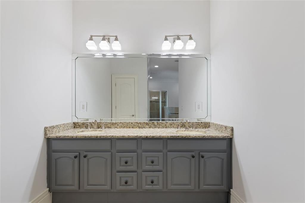 6509 Lily Trail Fairburn, GA 30213 - Photo 47 of 117 a bathroom with a granite countertop double vanity and a mirror