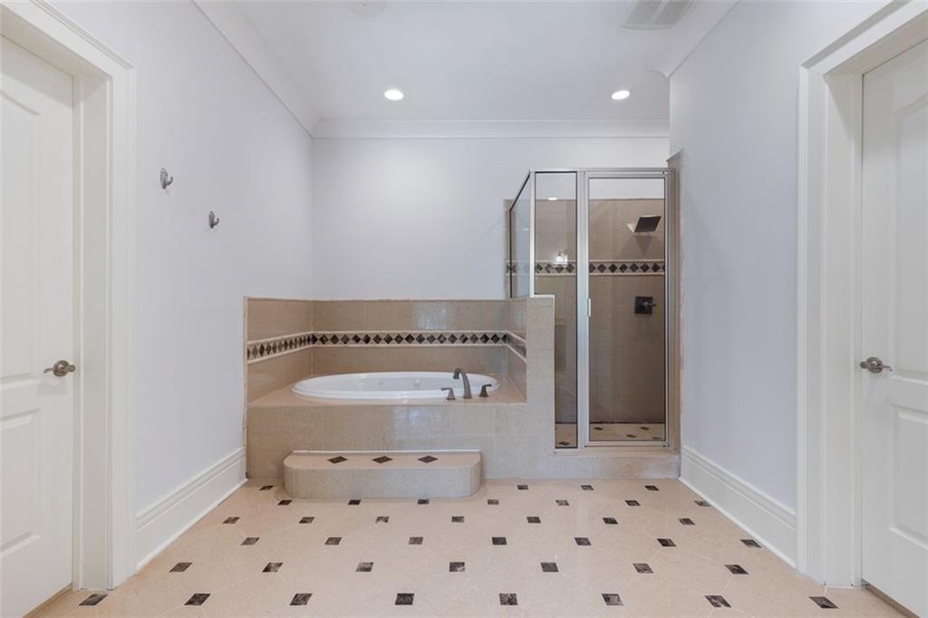 6509 Lily Trail Fairburn, GA 30213 - Photo 50 of 117 a bathroom with a toilet a sink and a shower