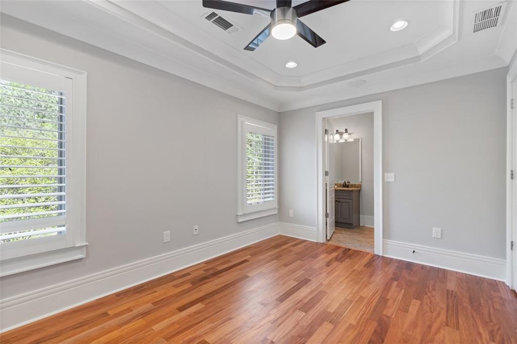 6509 Lily Trail Fairburn, GA 30213 - Photo 51 of 117 a view of empty room with wooden floor and fan
