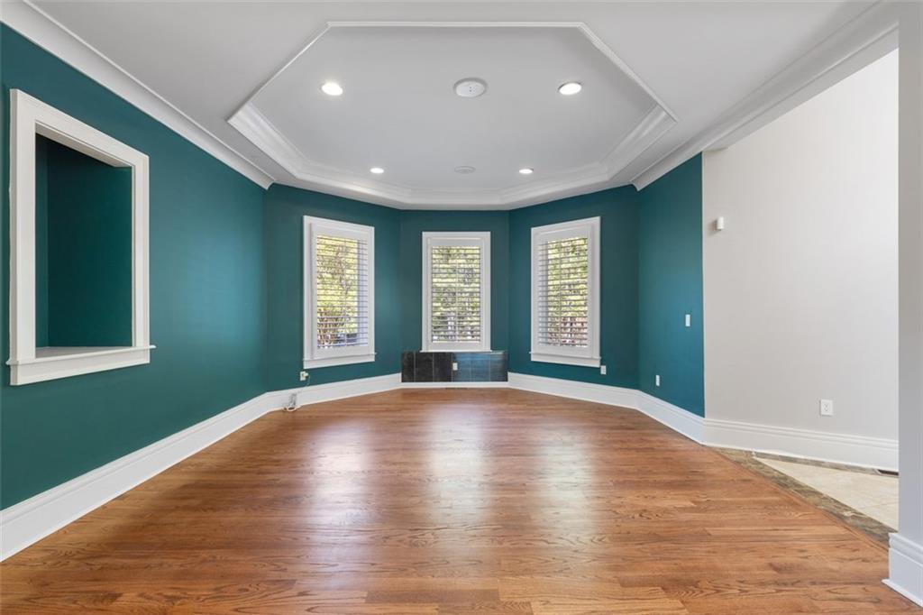 6509 Lily Trail Fairburn, GA 30213 - Photo 6 of 117 a view of an empty room with window and wooden floor