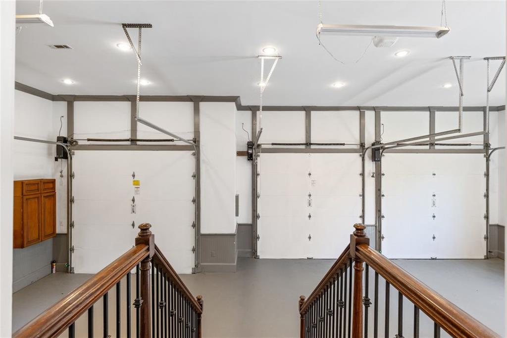 6509 Lily Trail Fairburn, GA 30213 - Photo 66 of 117 a view of a hallway with stainless steel appliances a refrigerator