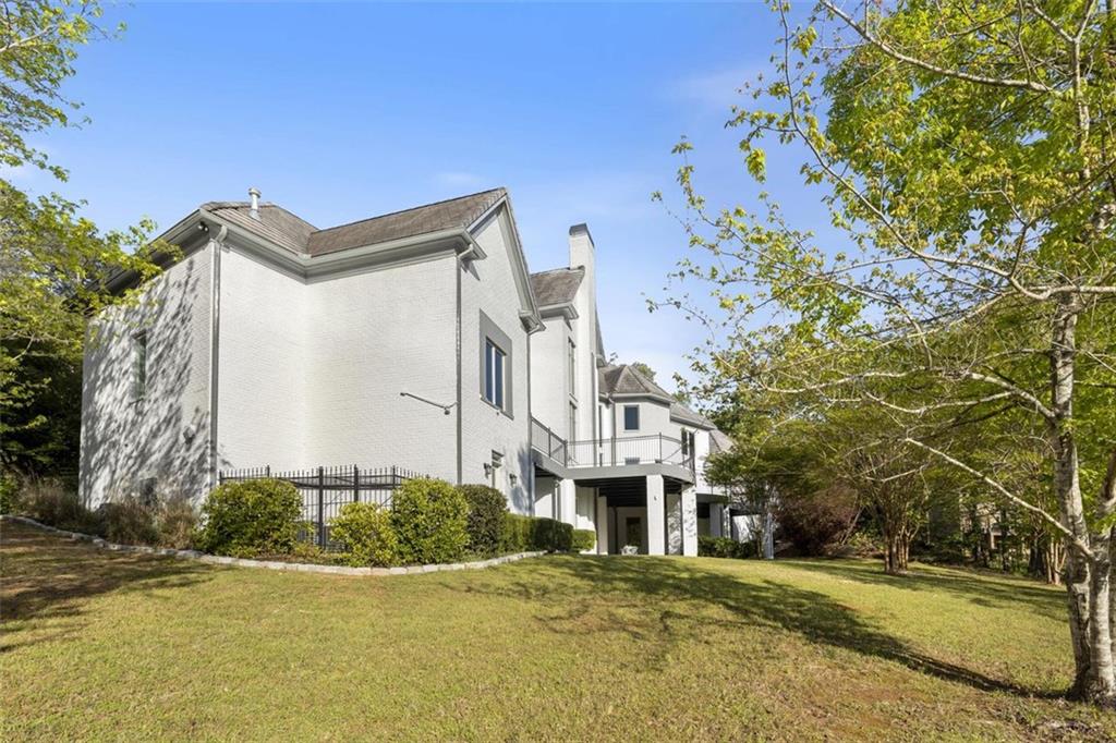 6509 Lily Trail Fairburn, GA 30213 - Photo 75 of 117 a front view of a building with a garden