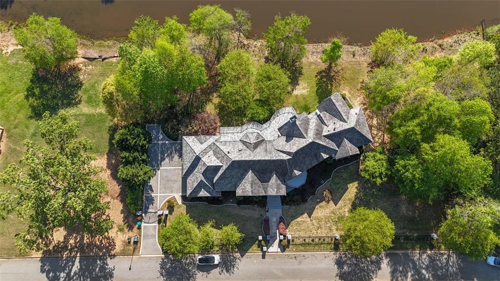 6509 Lily Trail Fairburn, GA 30213 - Photo 85 of 117 an aerial view of a house with a yard and a large tree