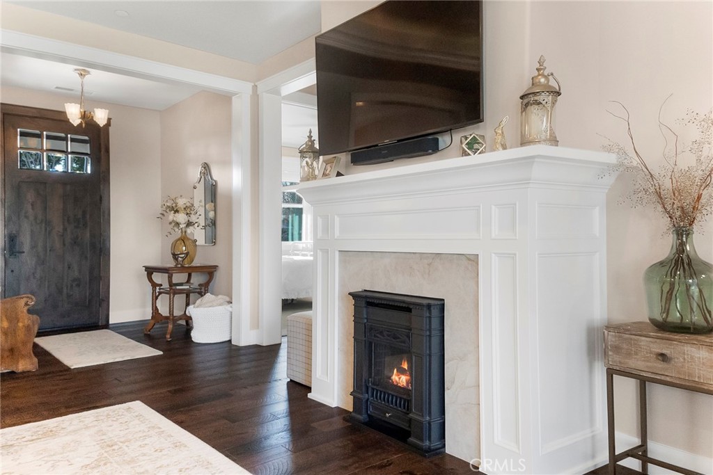 3424 Hackamore Lane Chico, CA 95973 - Photo 16 of 67 a living room with a fireplace and a flat screen tv