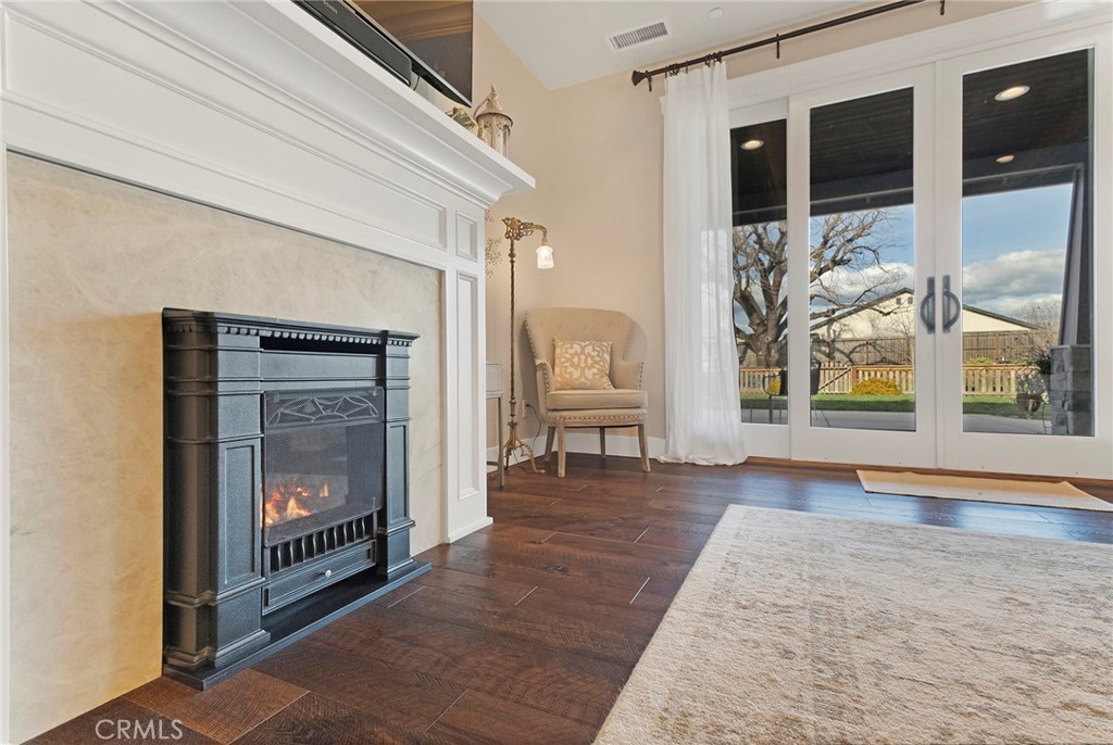 3424 Hackamore Lane Chico, CA 95973 - Photo 17 of 67 a view of an empty room with wooden floor fire place and a fireplace