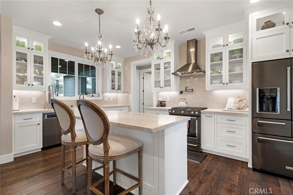3424 Hackamore Lane Chico, CA 95973 - Photo 18 of 67 a kitchen with stainless steel appliances granite countertop a dining table chairs stove and refrigerator