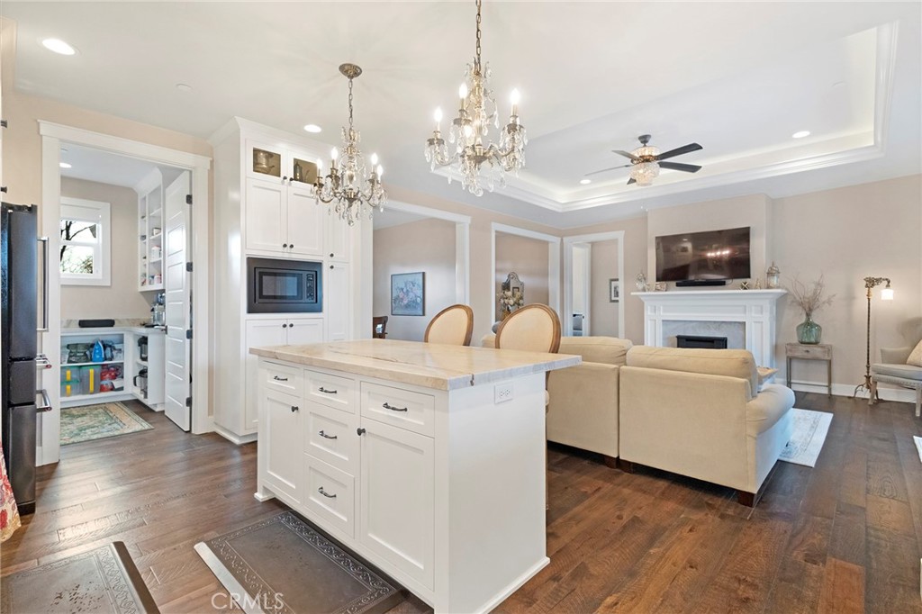 3424 Hackamore Lane Chico, CA 95973 - Photo 23 of 67 a living room with furniture a fireplace and a flat screen tv