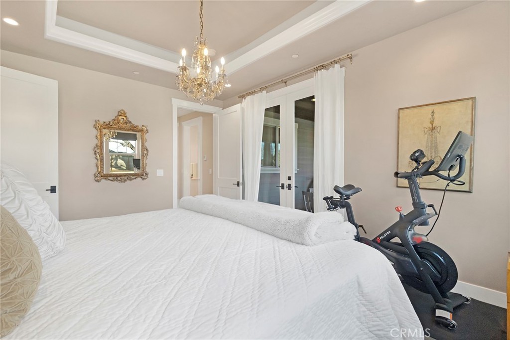 3424 Hackamore Lane Chico, CA 95973 - Photo 31 of 67 a bedroom with a bed and a chandelier