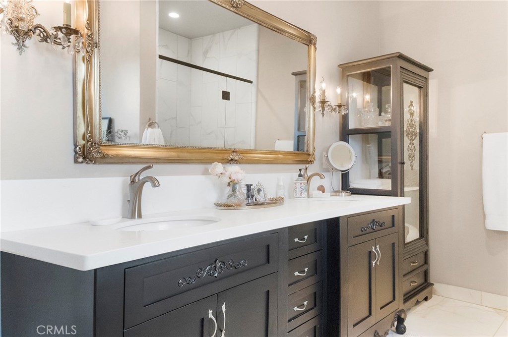 3424 Hackamore Lane Chico, CA 95973 - Photo 32 of 67 a bathroom with a sink double vanity and a mirror