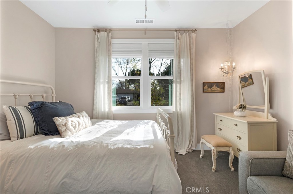3424 Hackamore Lane Chico, CA 95973 - Photo 39 of 67 a bedroom with a large bed and a window