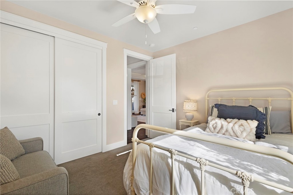 3424 Hackamore Lane Chico, CA 95973 - Photo 40 of 67 a bedroom with a bed and a chandelier