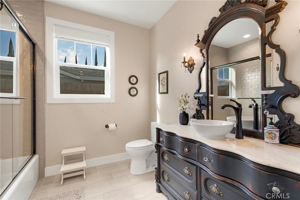3424 Hackamore Lane Chico, CA 95973 - Photo 41 of 67 a bathroom with a double vanity sink and a mirror