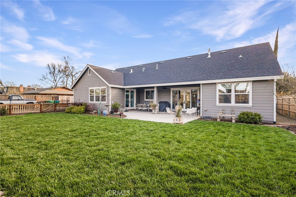3424 Hackamore Lane Chico, CA 95973 - Photo 56 of 67 a front view of a house with a garden and porch