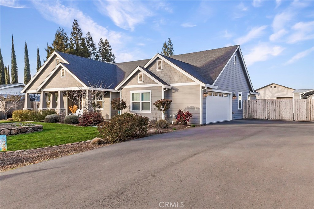 3424 Hackamore Lane Chico, CA 95973 - Photo 58 of 67 a front view of a house with a yard and garage