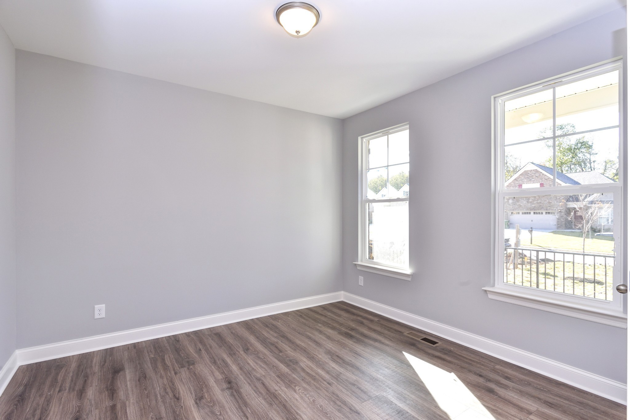 74 Remington Road Lebanon, TN 37090 - Photo 9 of 25 an empty room with wooden floor and windows