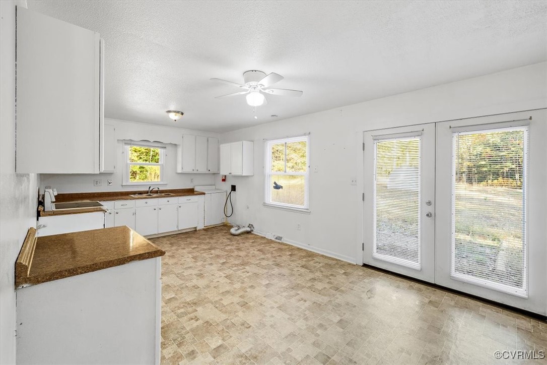 21814 Carson Road Dinwiddie, VA 23841 - Photo 13 of 24 a view of a kitchen with wooden floor and natural light