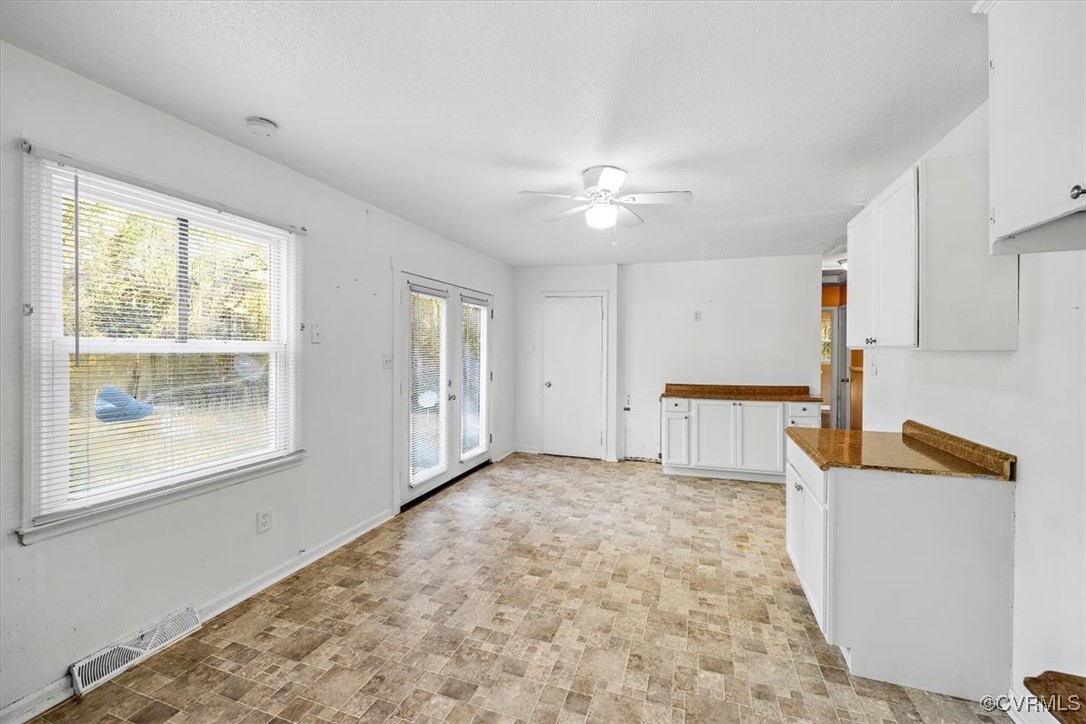 21814 Carson Road Dinwiddie, VA 23841 - Photo 15 of 24 a view of a kitchen with furniture an empty room and a window