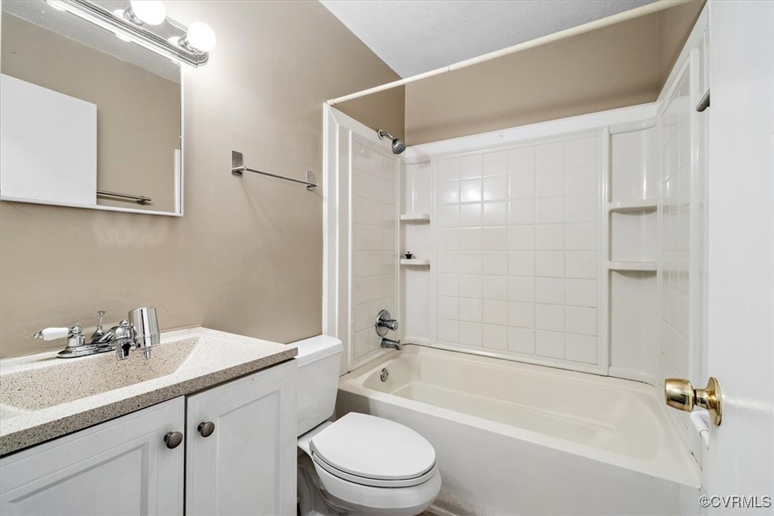 21814 Carson Road Dinwiddie, VA 23841 - Photo 20 of 24 a bathroom with a bathtub shower sink vanity mirror and toilet