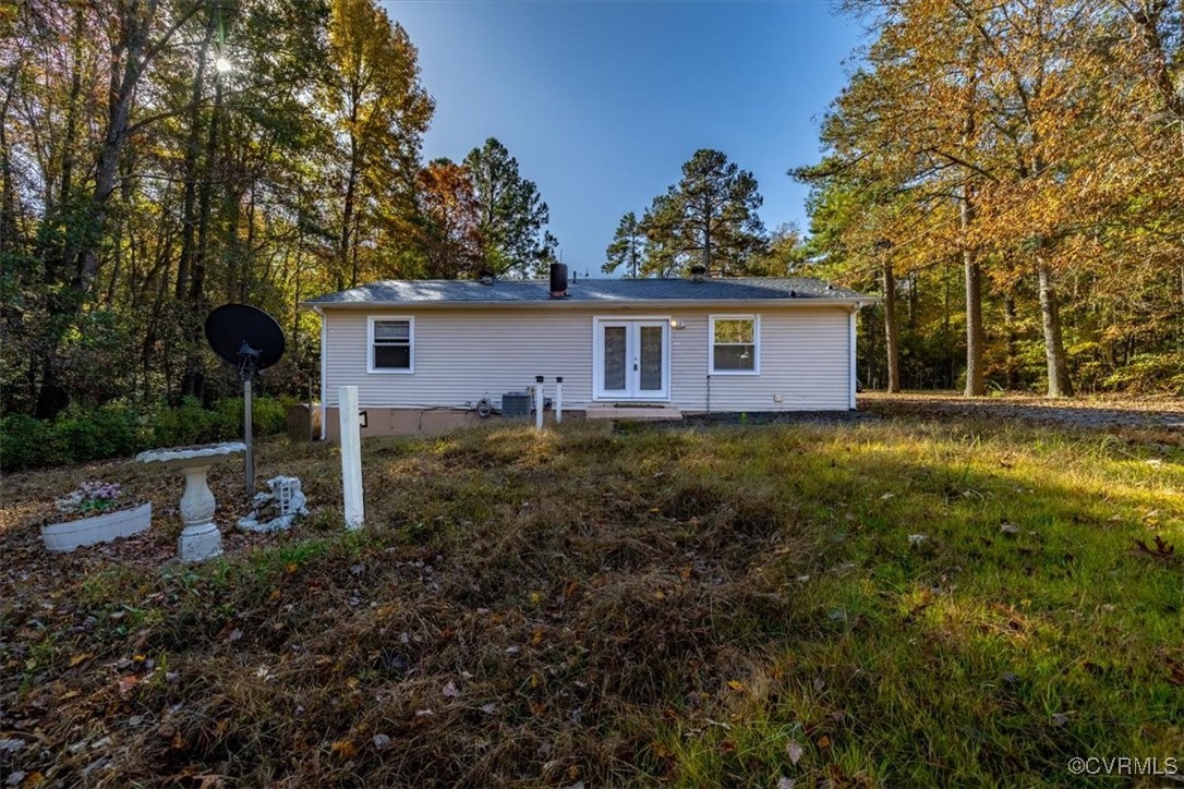 21814 Carson Road Dinwiddie, VA 23841 - Photo 21 of 24 a view of a house with yard and a garden