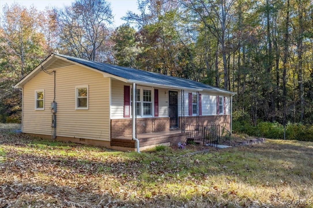 21814 Carson Road Dinwiddie, VA 23841 - Photo 5 of 24 a view of a house with a yard and large trees
