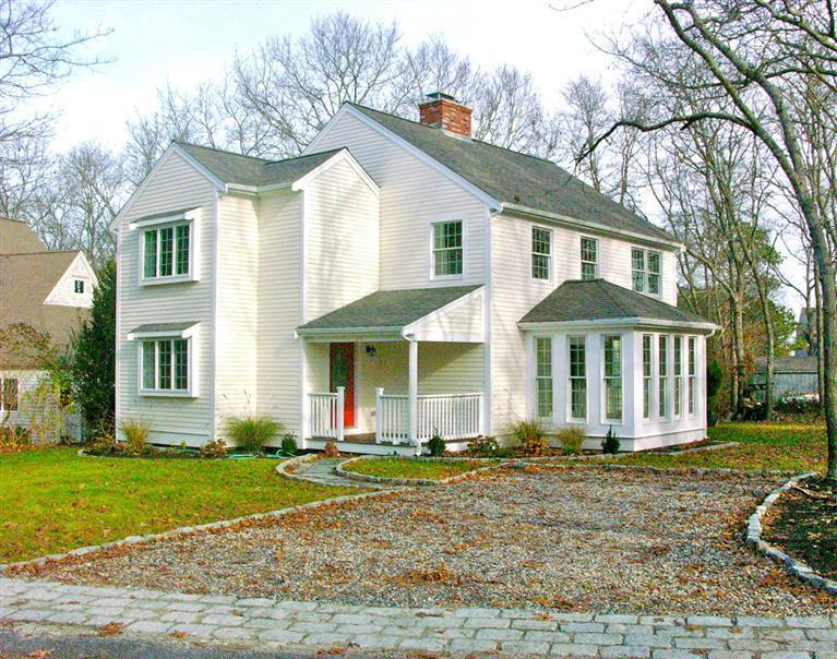 129 Summersea Road Mashpee, MA 02649 - Photo 1 of 6 a front view of a house with a yard