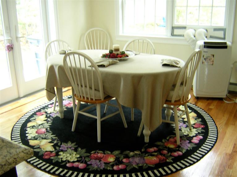 129 Summersea Road Mashpee, MA 02649 - Photo 4 of 6 a view of a dining room with furniture and floor to ceiling window