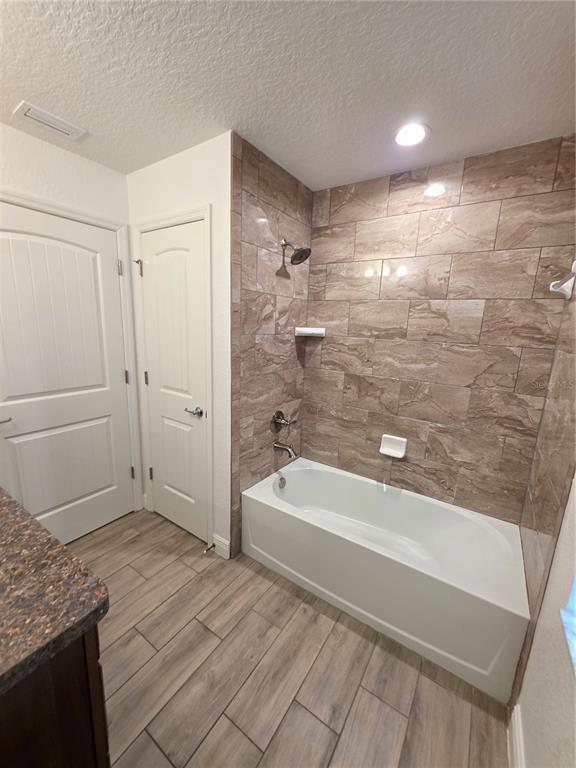 11240 Marvelwood Road Weeki Wachee, FL 34614 - Photo 13 of 21 a bathroom with a bathtub and a shower