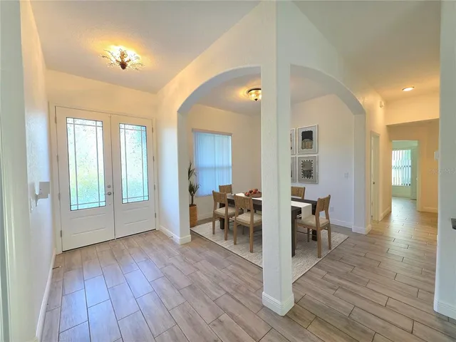a view of a livingroom with furniture and hardwood floor