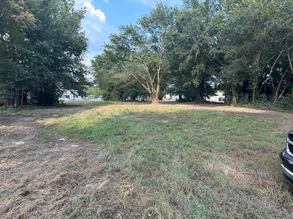 3110 West Gentry Parkway Tyler, TX 75702 - Photo 27 of 34 a view of a field with trees in the background
