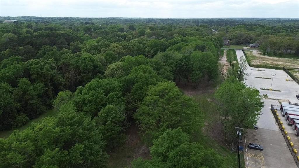3110 West Gentry Parkway Tyler, TX 75702 - Photo 9 of 34 an aerial view of a house with a yard