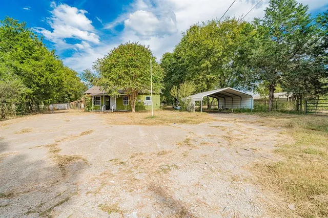 a house with trees in the background