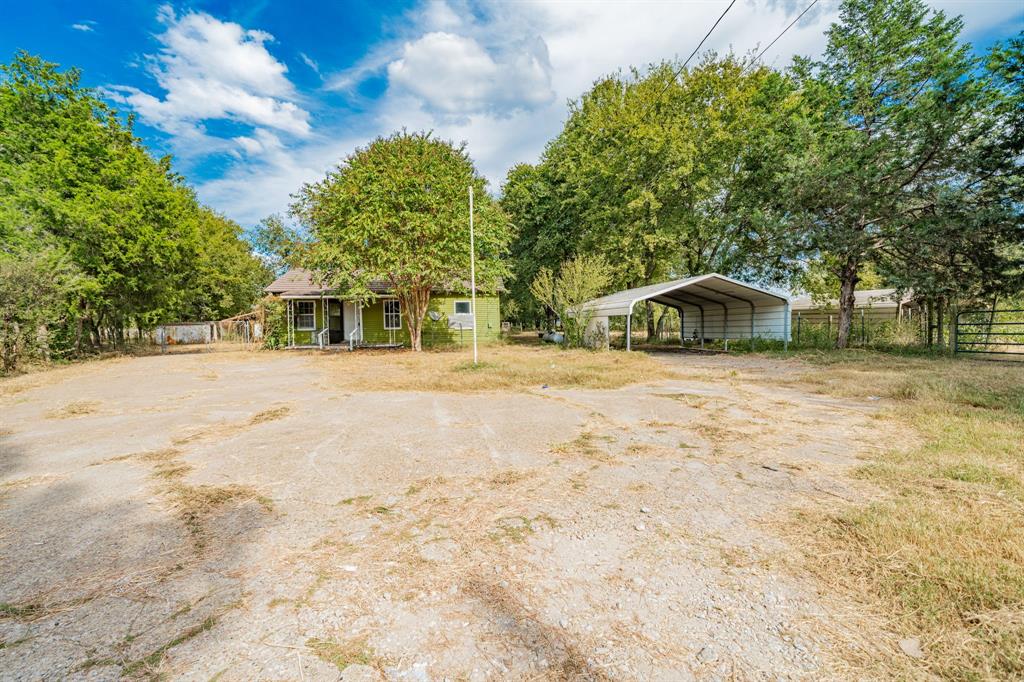 113 South Spikes Road Corsicana, TX 75110 - Photo 2 of 19 a house with trees in the background
