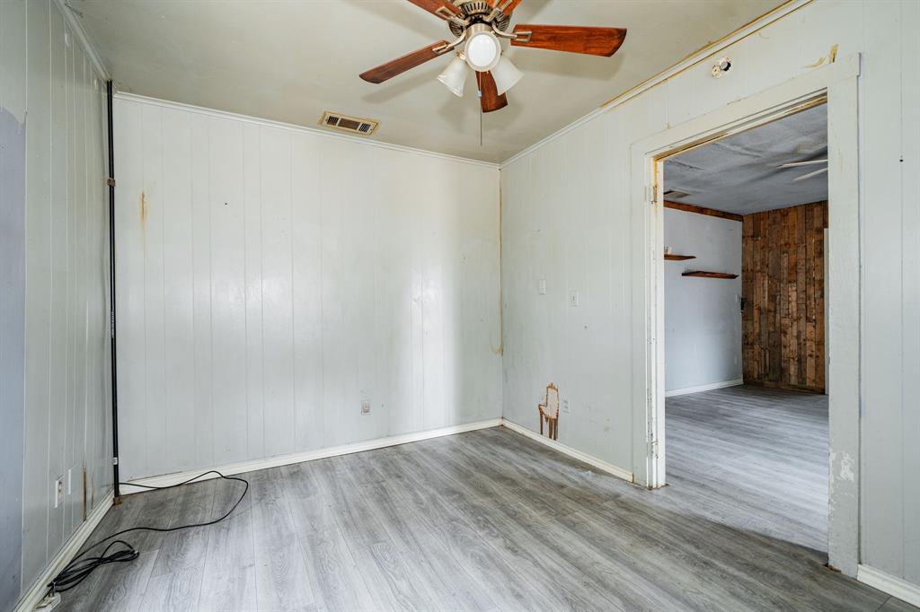 113 South Spikes Road Corsicana, TX 75110 - Photo 7 of 19 a view of an empty room with wooden floor
