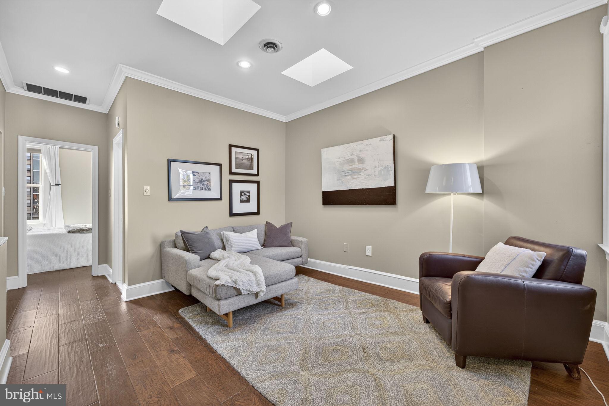 1218 G Street Southeast Washington, DC 20003 - Photo 25 of 37 a living room with furniture and wooden floor