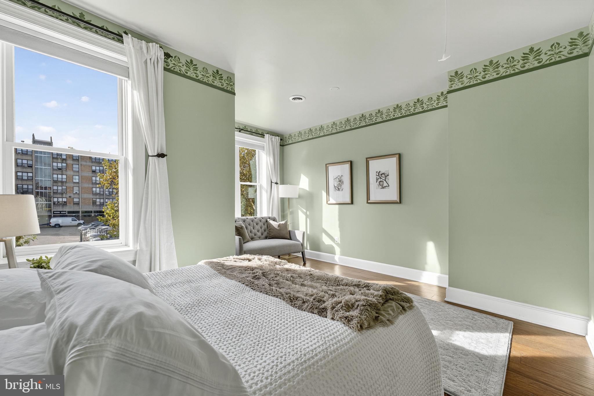 1218 G Street Southeast Washington, DC 20003 - Photo 27 of 37 a bedroom with a large bed and a window