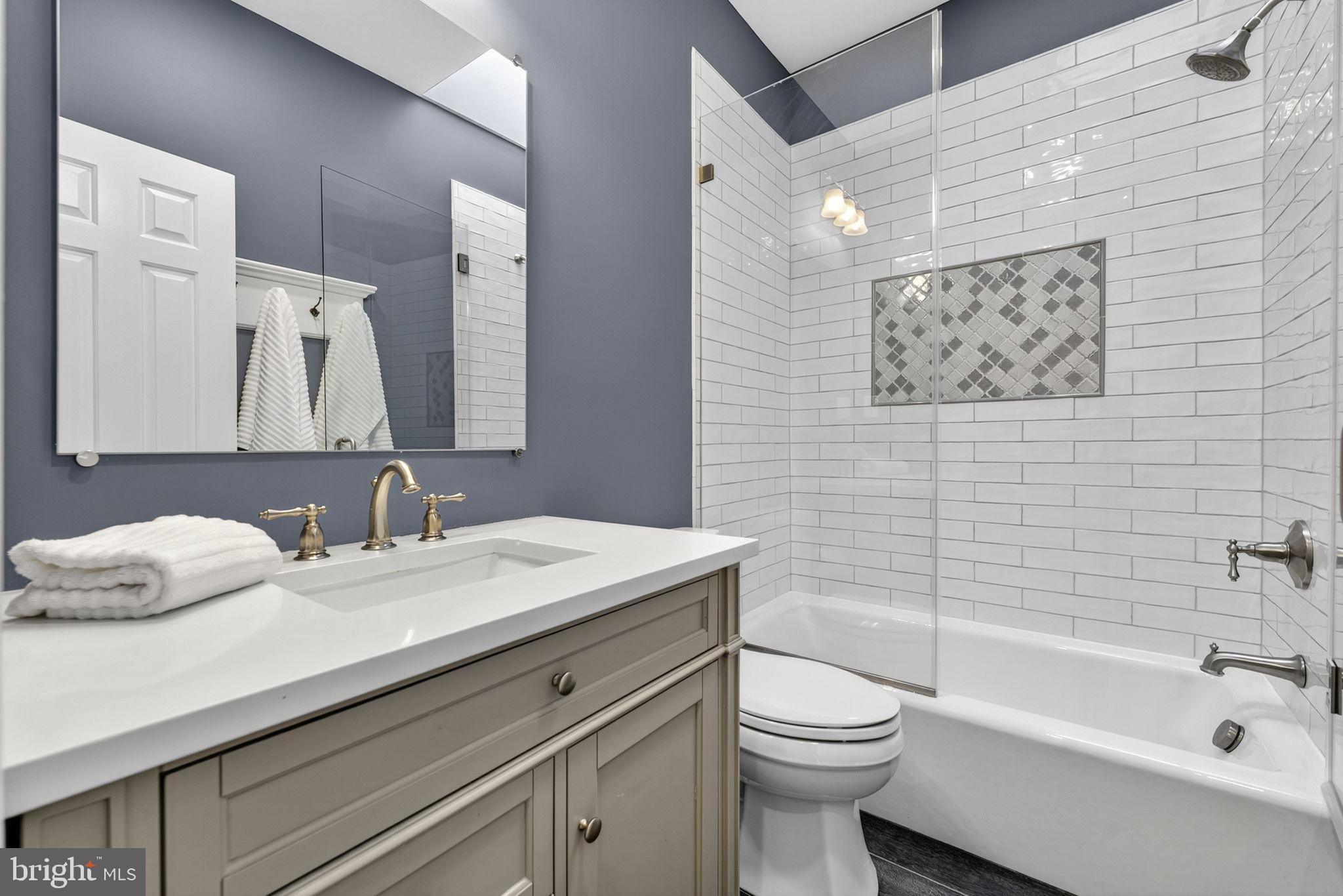 1218 G Street Southeast Washington, DC 20003 - Photo 30 of 37 a bathroom with a sink a toilet and a bathtub