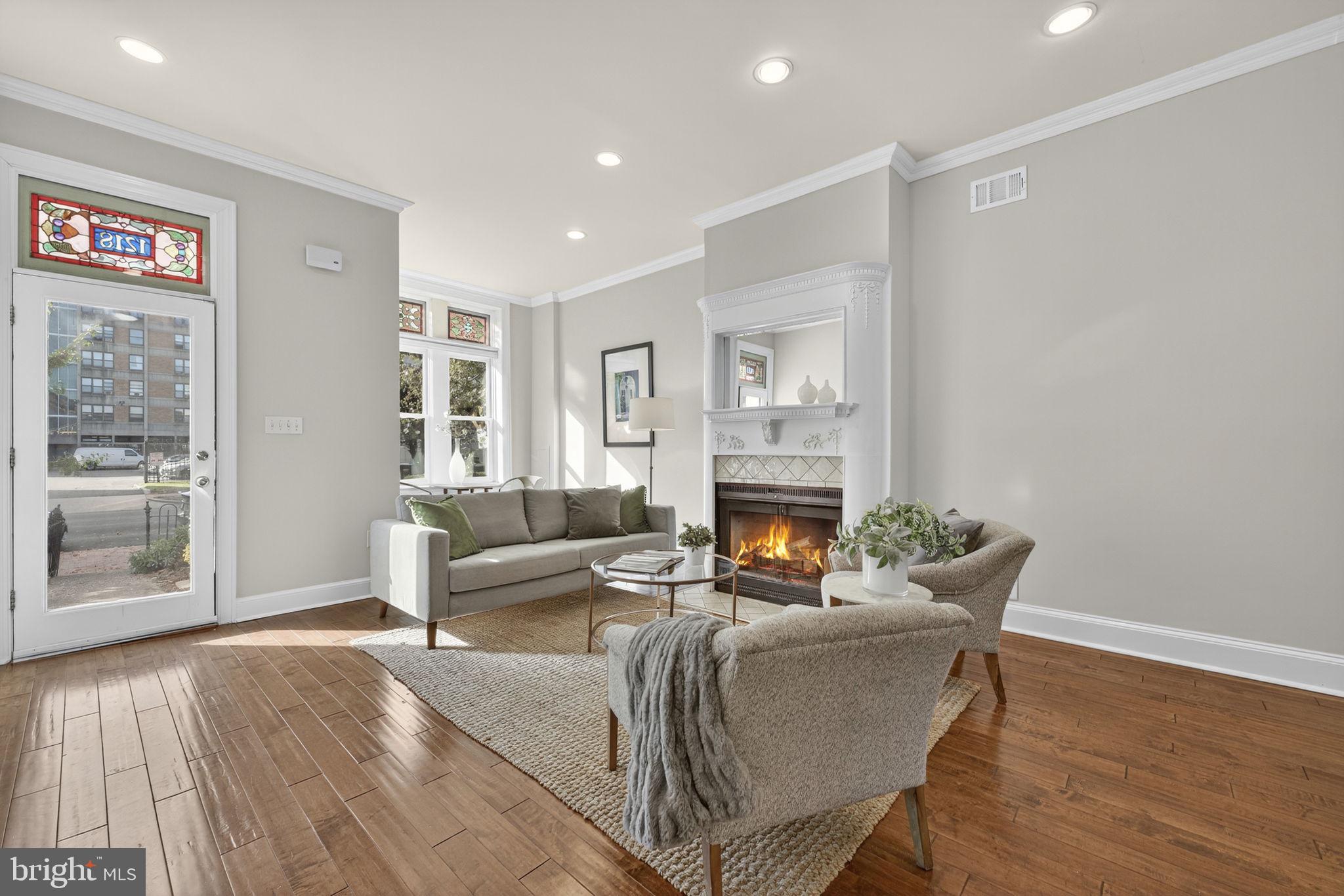 1218 G Street Southeast Washington, DC 20003 - Photo 3 of 37 a living room with furniture and a fireplace