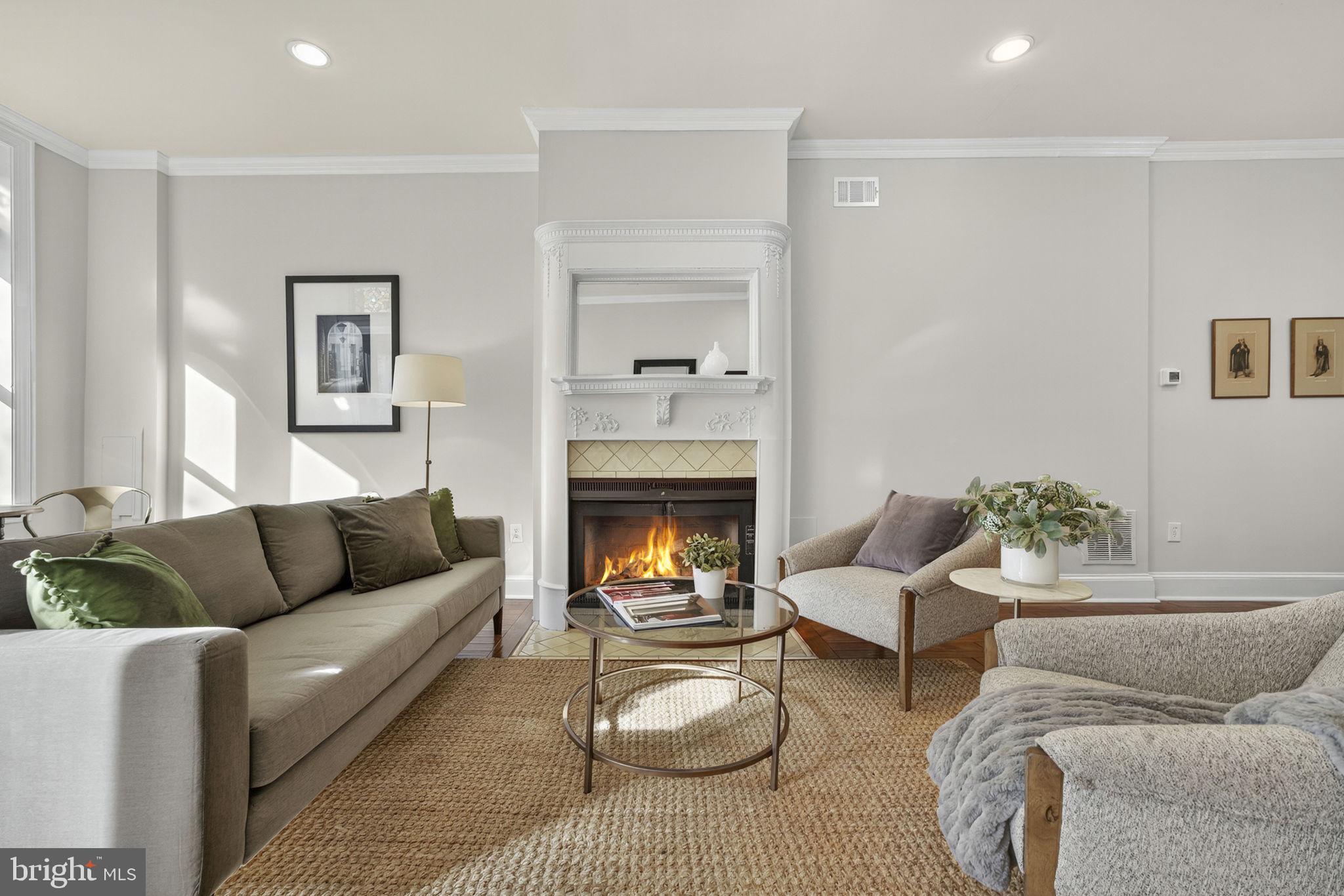 1218 G Street Southeast Washington, DC 20003 - Photo 4 of 37 a living room with furniture and a fireplace