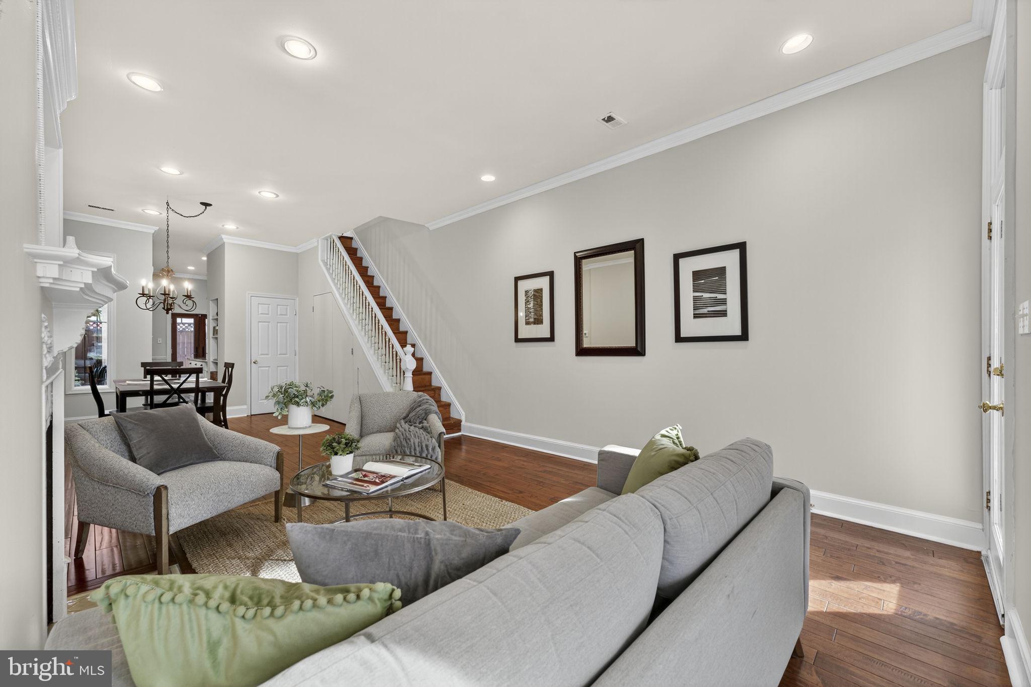 1218 G Street Southeast Washington, DC 20003 - Photo 6 of 37 a living room with furniture and a wooden floor
