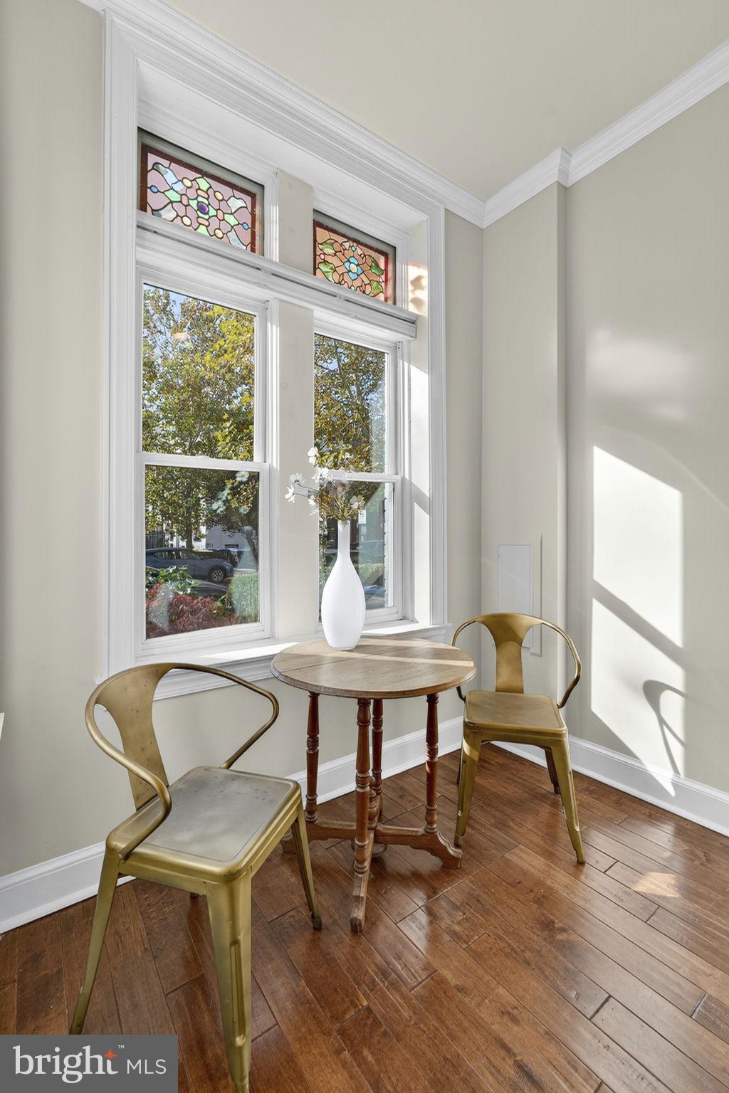 1218 G Street Southeast Washington, DC 20003 - Photo 7 of 37 a view of a work space with wooden floor and a window