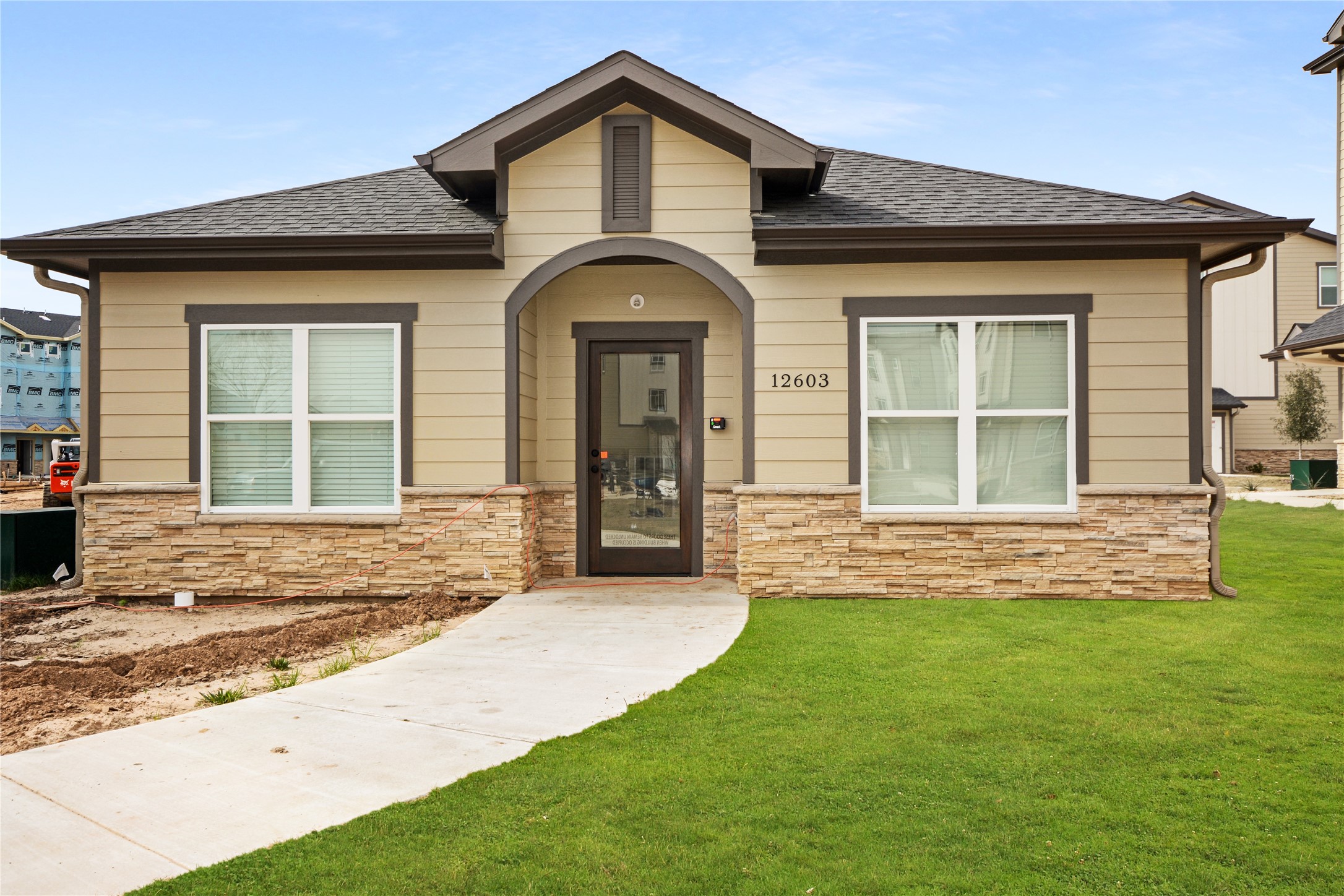 12603 Telge Road, Unit 8EH Cypress, TX 77429 - Photo 29 of 32 a view of a house with a yard