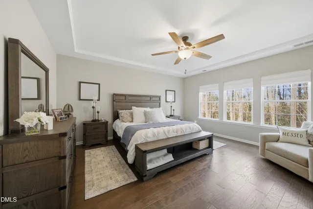 a bed room with a bed window and a couch