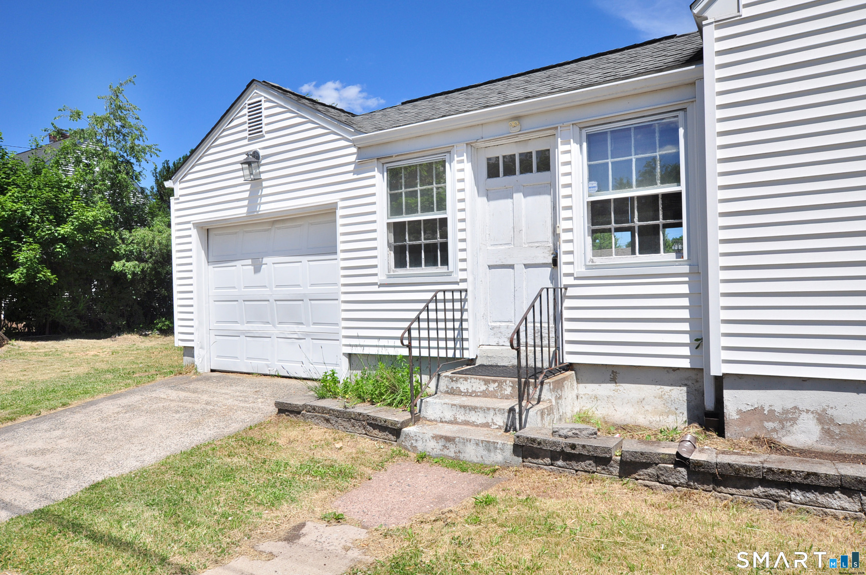 103 West Center Street Manchester, CT 06040 - Photo 2 of 29 a view of a house with backyard and sitting area