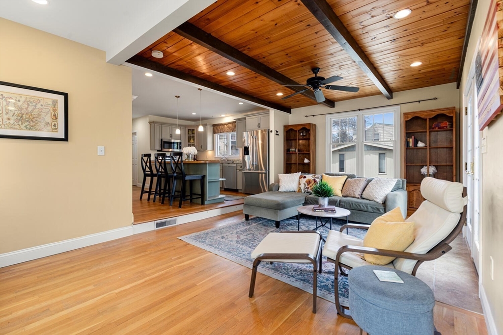 56 Grapevine Avenue Lexington, MA 02421 - Photo 16 of 38 a living room with furniture and a wooden floor