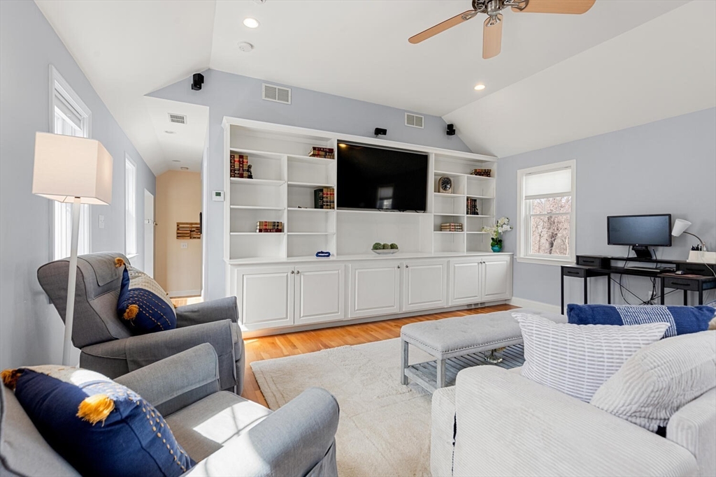 56 Grapevine Avenue Lexington, MA 02421 - Photo 22 of 38 a living room with furniture and a flat screen tv