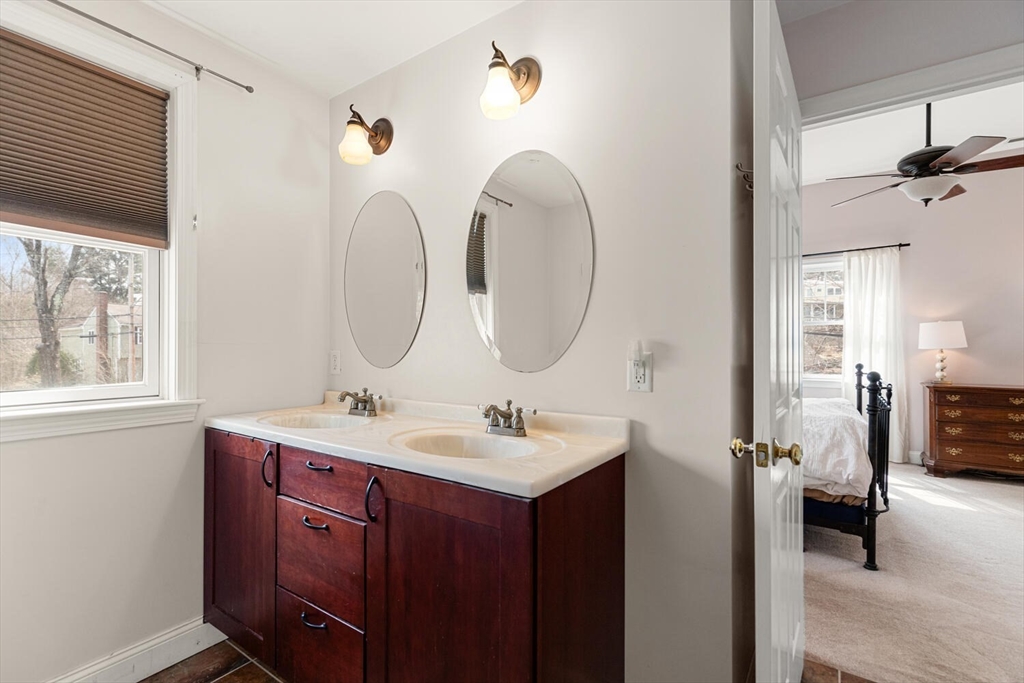 56 Grapevine Avenue Lexington, MA 02421 - Photo 27 of 38 a bathroom with a double vanity sink and a mirror